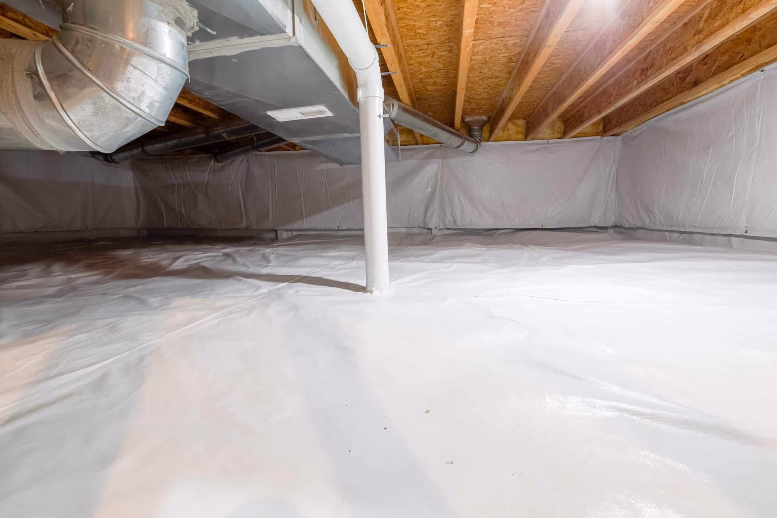 Encapsulated crawl space with a sealed white liner up the walls and across the floor